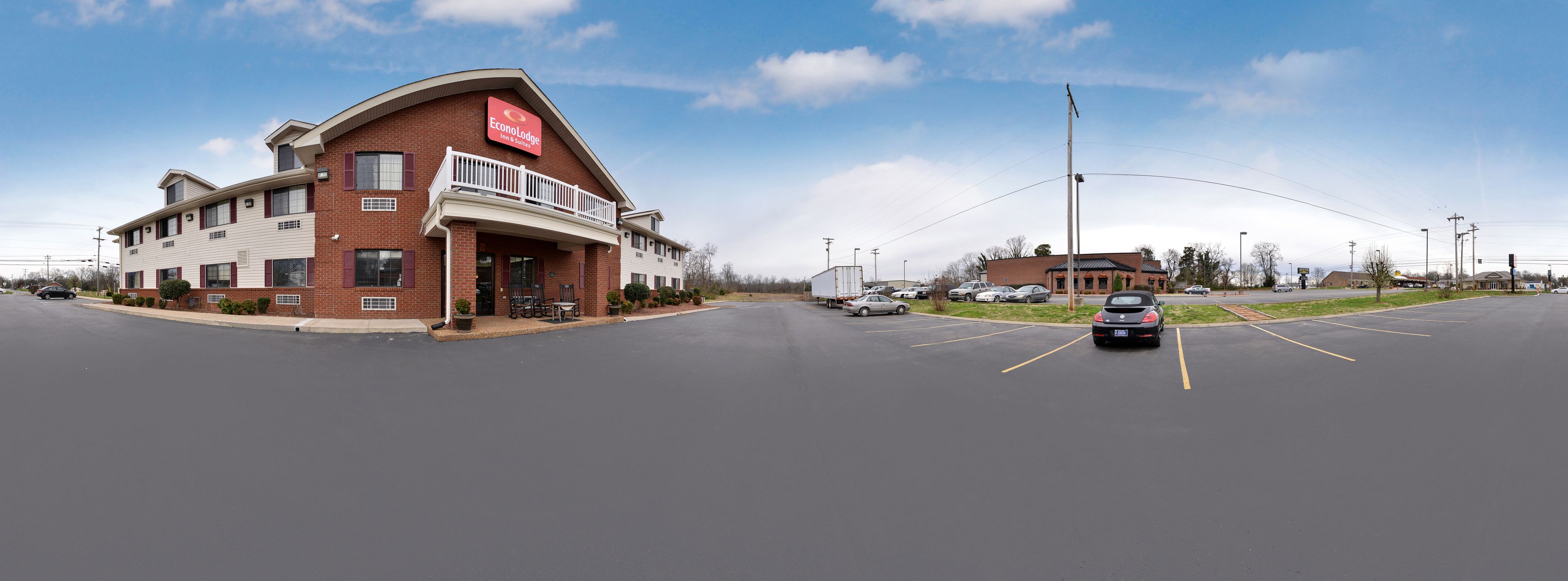 A two-story brick building with a red sign reading "EconoLodge."