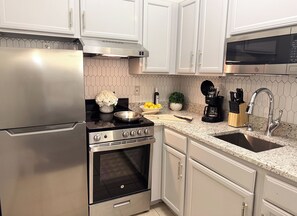 Mini-fridge, microwave, oven, stovetop