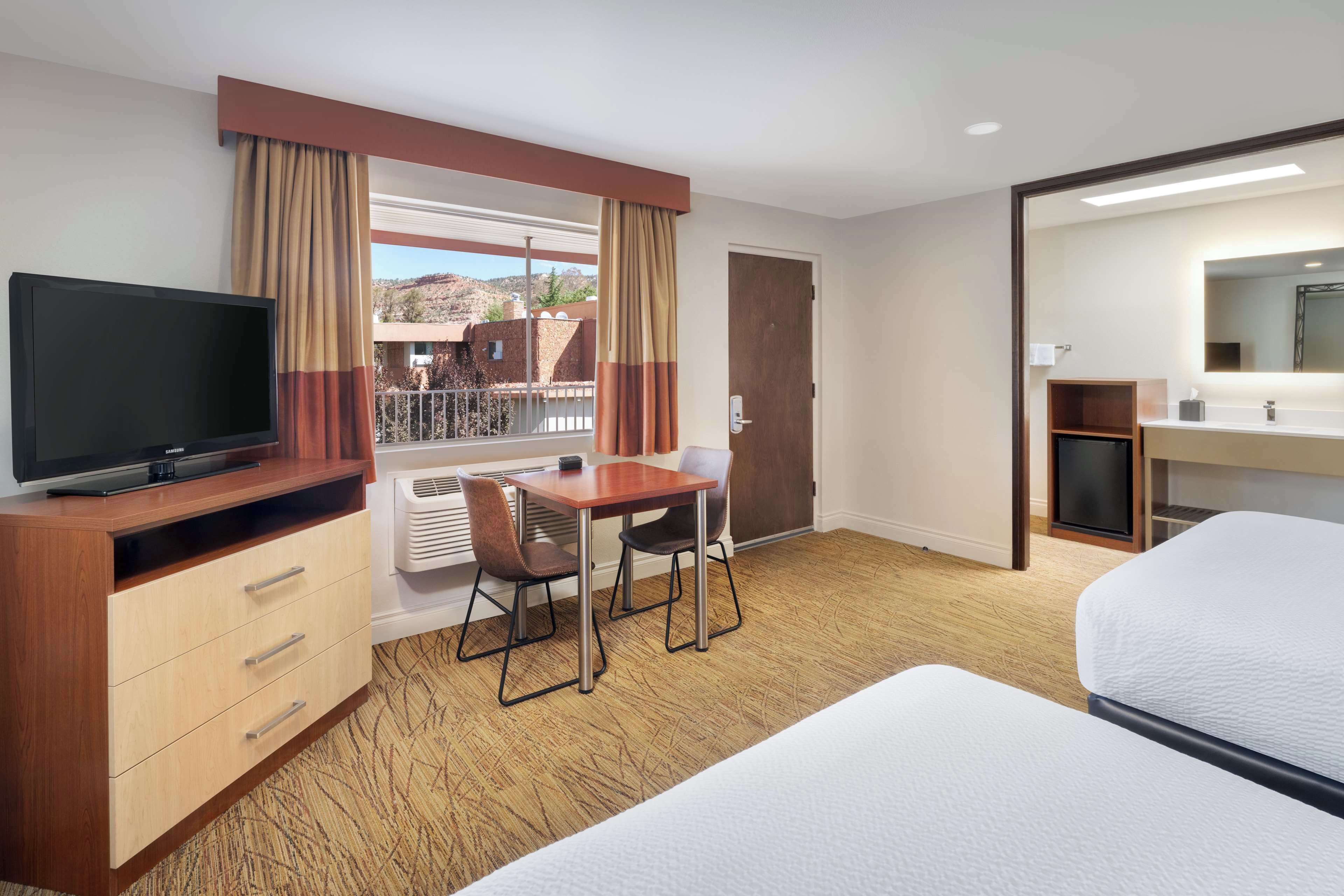 Premium bedding, pillow-top beds, in-room safe, laptop workspace