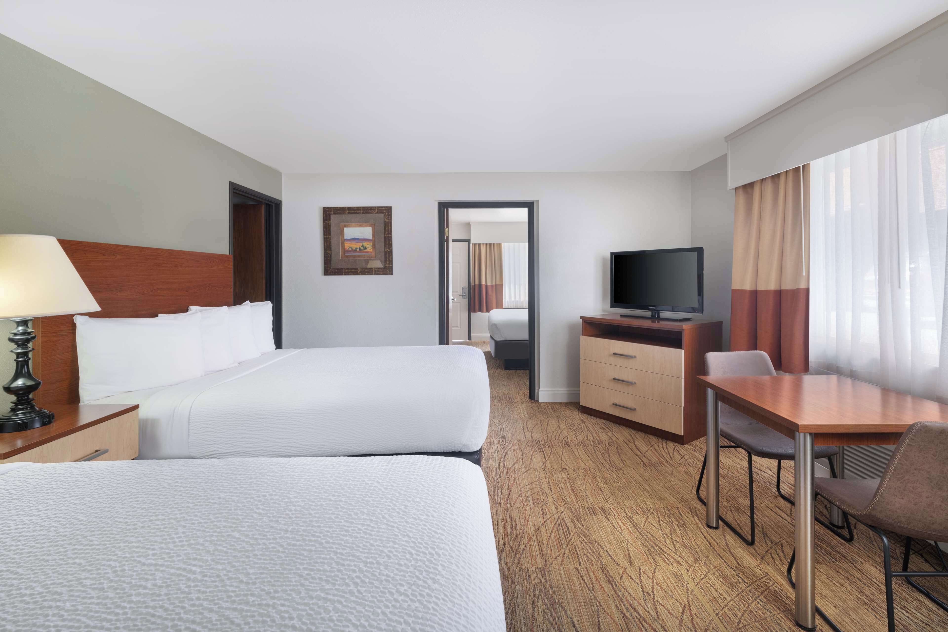 family suite, 2 queen beds, non smoking, refrigerator & microwave | premium bedding, pillow-top beds, in-room safe, laptop workspace