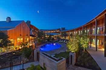 Outdoor pool, open 9:00 AM to 9:00 PM, pool umbrellas, sun loungers at Lone Star Court, by Valencia Hotel Collection