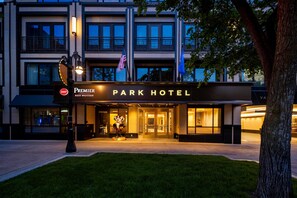 A hotel entrance with a marquee sign, a flag, and a well-lit facade. - Best Western Premier Park Hotel (Madison)