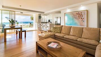 Premier 2 Bedroom Ocean View Courtyard NE | Living area | 65-inch flat-screen TV with satellite channels, TV