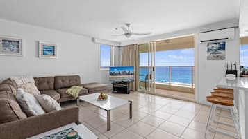2 bedroom ocean view E | Living area | 65-inch flat-screen TV with satellite channels, TV