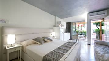 Desk, iron/ironing board, bed sheets