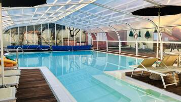 Indoor pool, seasonal outdoor pool, pool umbrellas, sun loungers