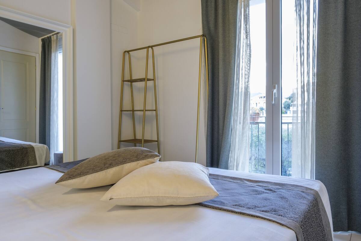 Desk, iron/ironing board, bed sheets