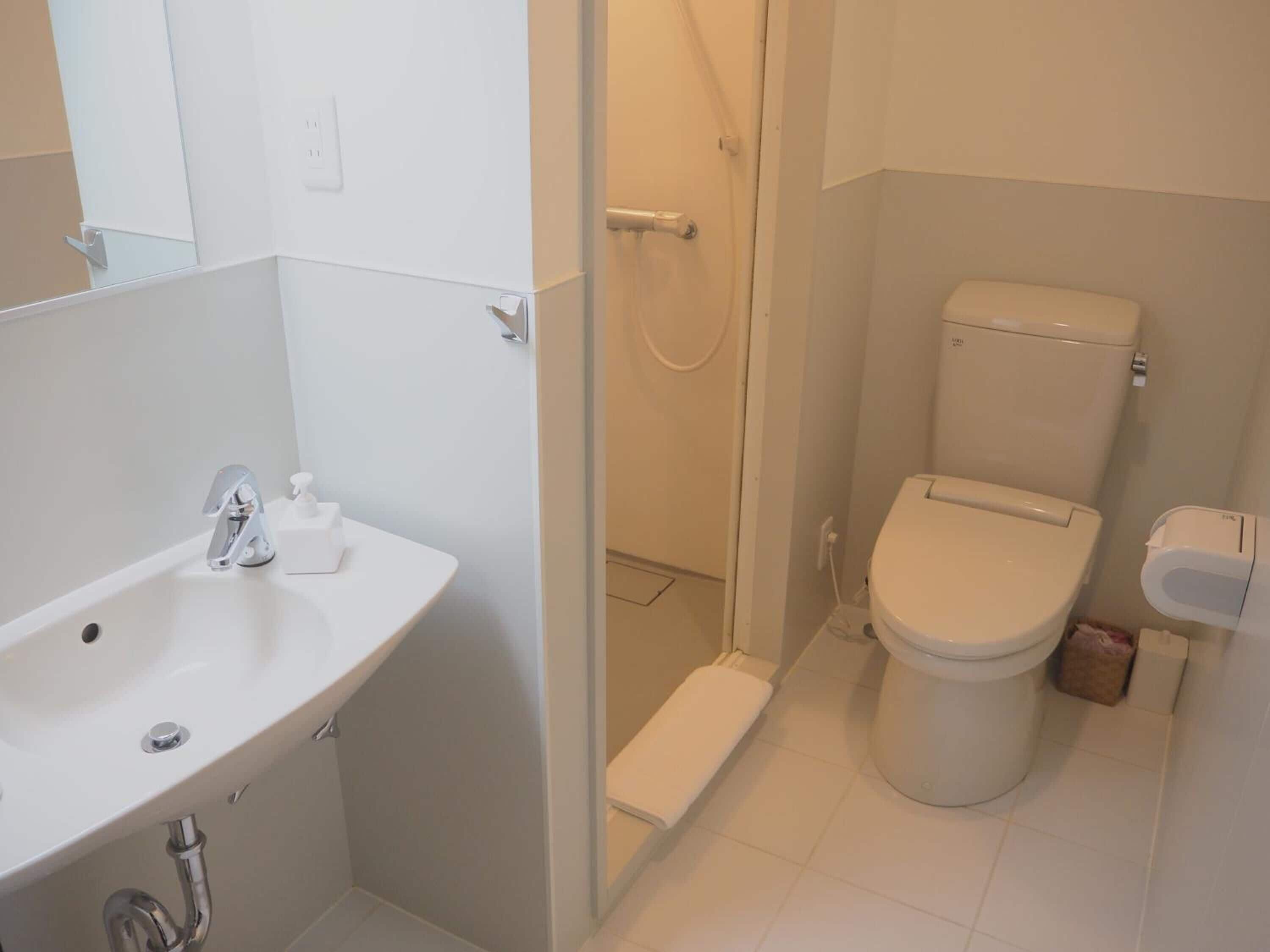 shower, hair dryer, bathrobes, slippers