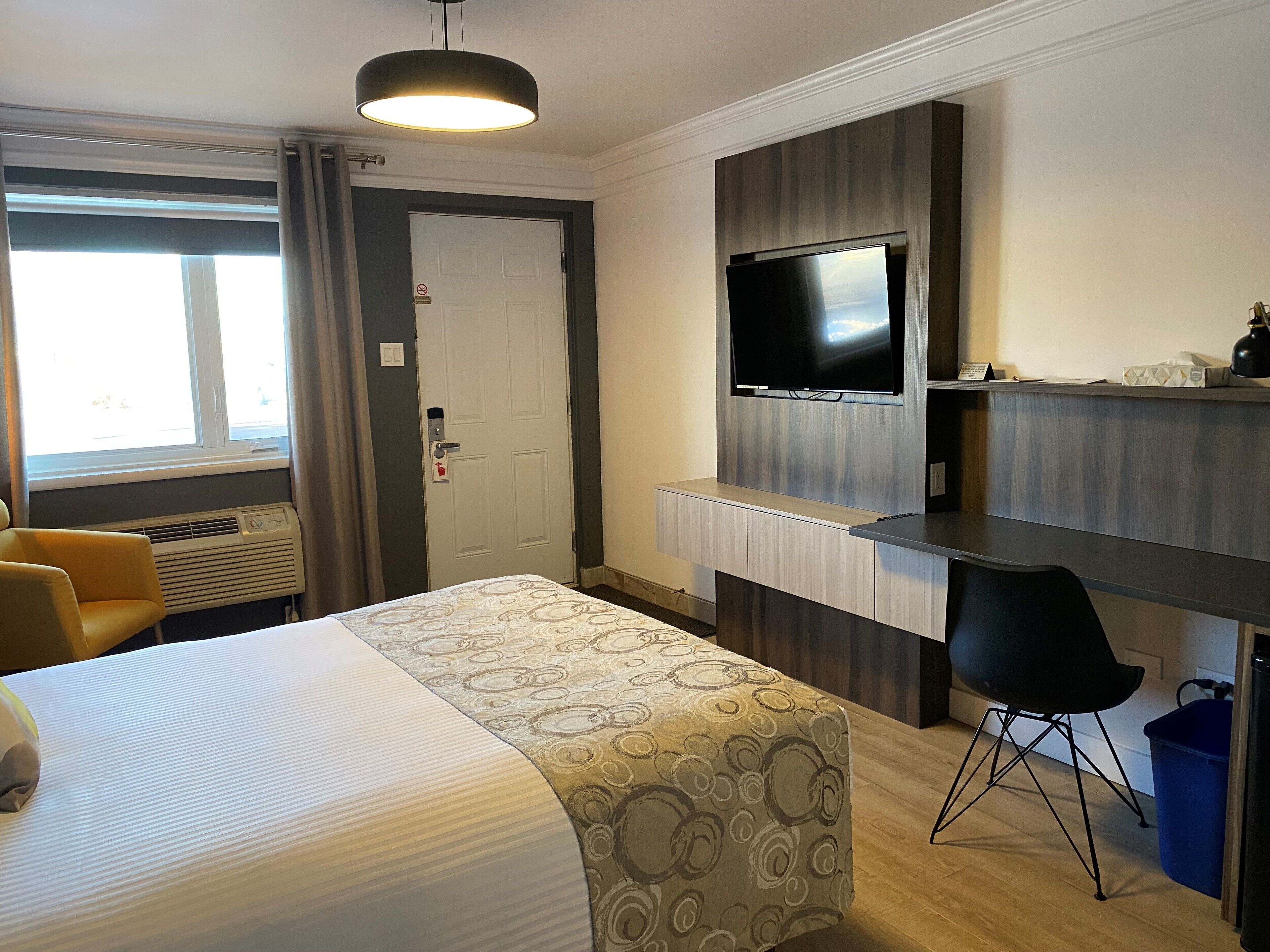 junior suite exterior entrance | desk, laptop workspace, blackout curtains, iron/ironing board