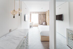 Habitación ejecutiva | Ropa de cama de alta calidad y minibar