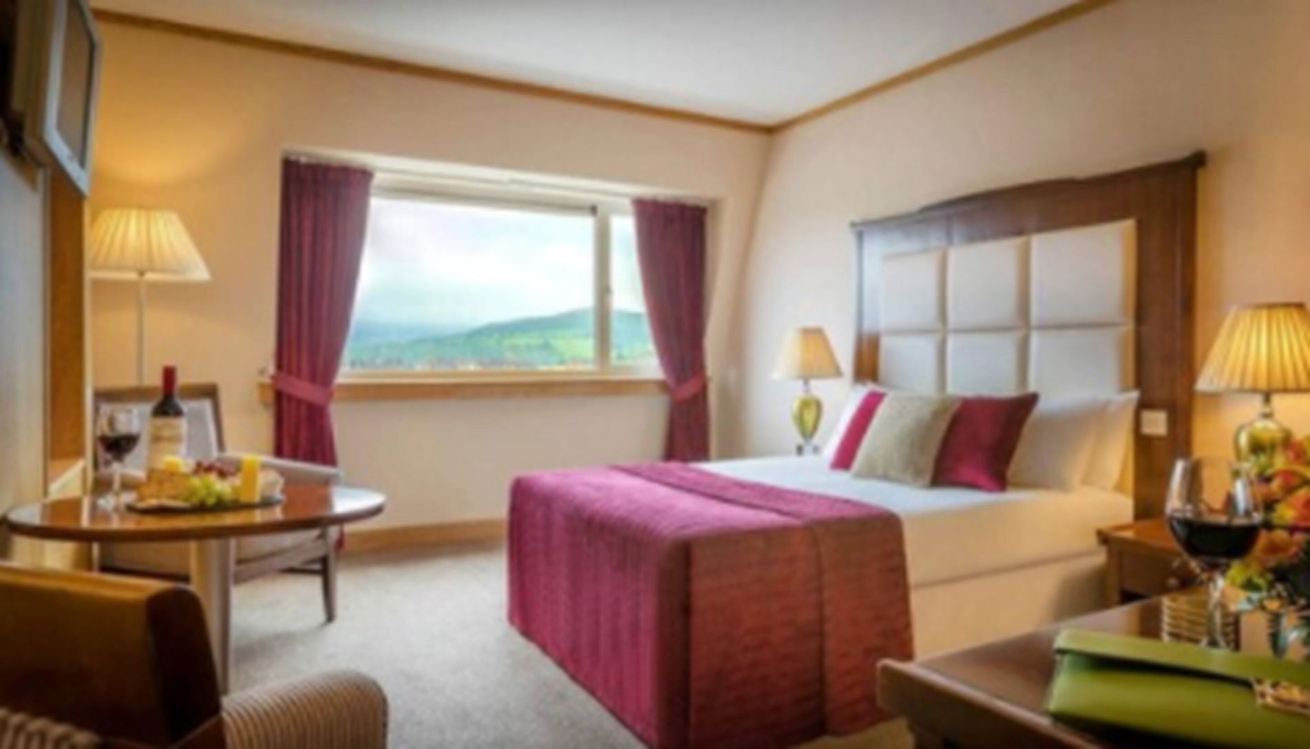 Premium bedding, desk, laptop workspace, blackout curtains