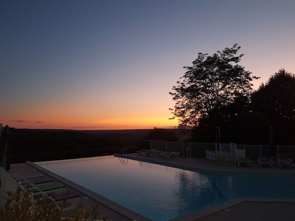 Seasonal outdoor pool, pool umbrellas, pool loungers
