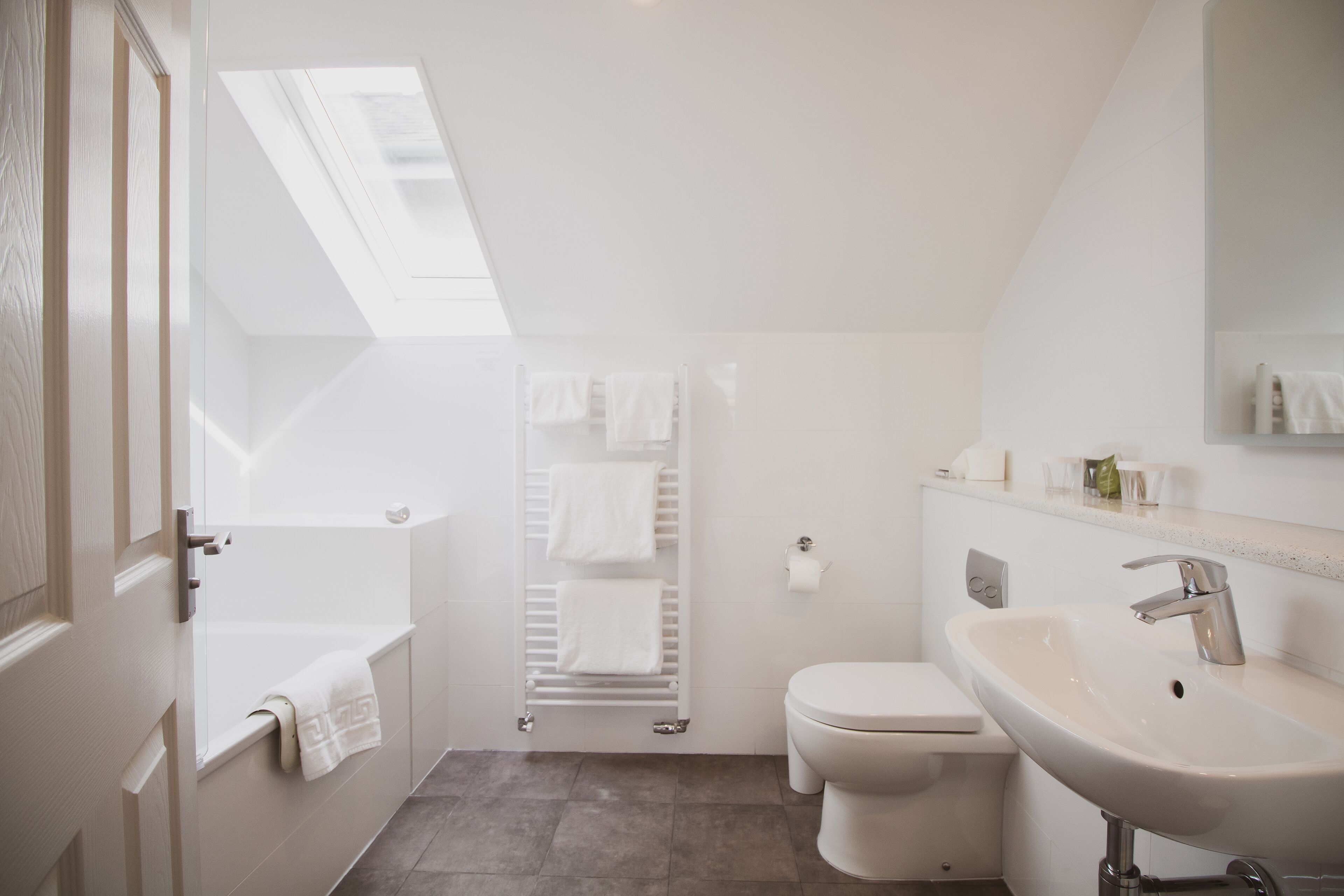 superior double room | bathroom | deep-soaking bathtub, free toiletries, hair dryer, towels