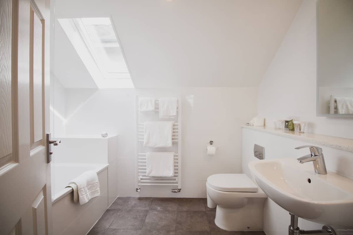 superior double room | bathroom | deep-soaking bathtub, free toiletries, hair dryer, towels