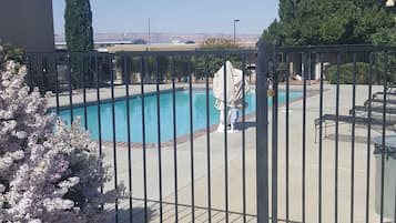 Seasonal outdoor pool, pool loungers