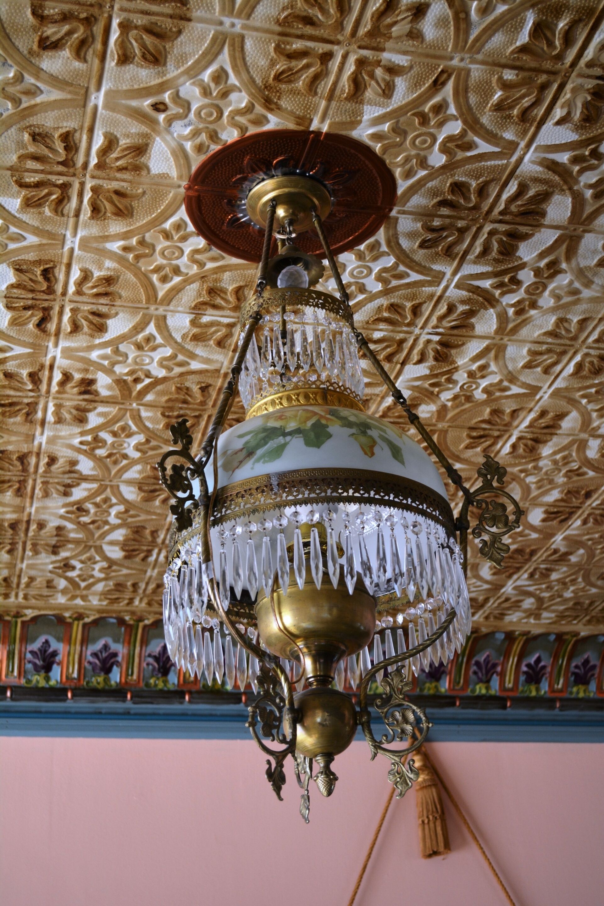 A chandelier with intricate designs and crystal details.