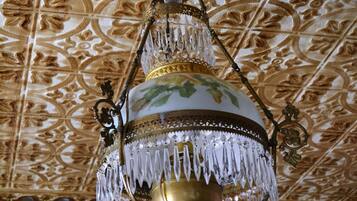 A chandelier with intricate designs and crystal details.