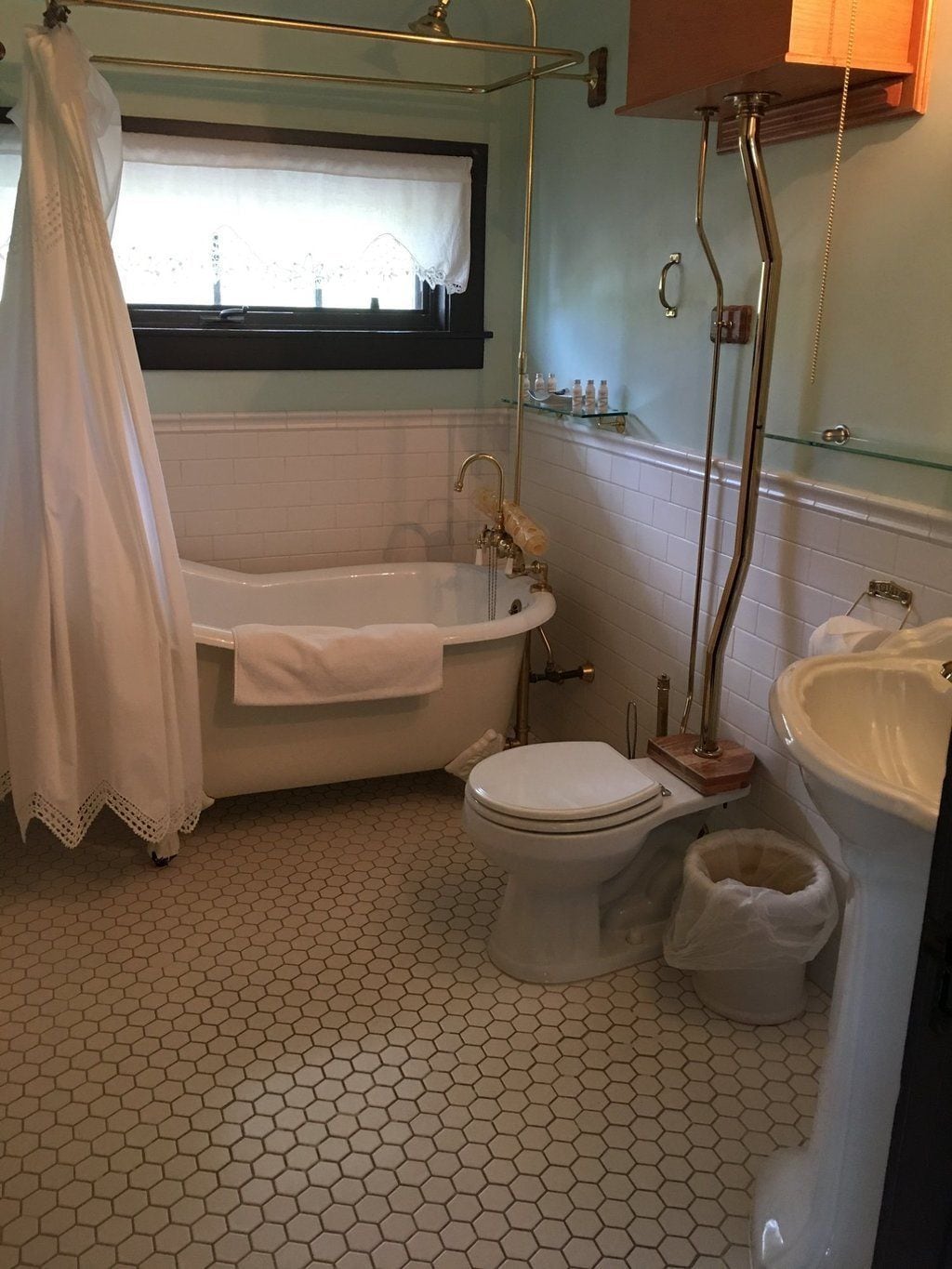 A bathroom with a bathtub, toilet, and sink.