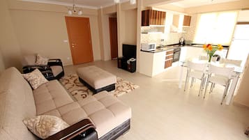 Apartment, 3 Bedrooms | Living area | 33-inch LCD TV with satellite channels, TV