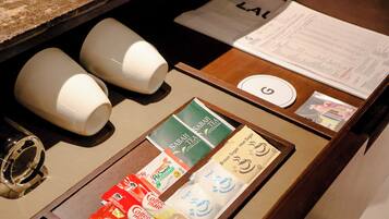 A coffee station with various coffee pods and a menu.