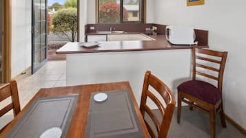 Superior Garden Apartment | Private kitchen | Full-size fridge, microwave, oven, stovetop