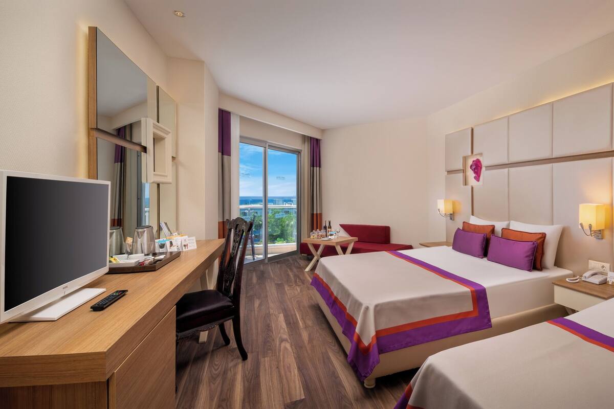 Standard Room, Partial Sea View | Minibar, in-room safe, desk, soundproofing