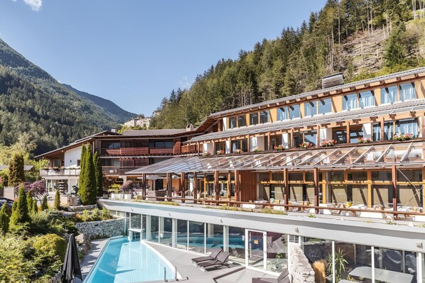 Indoor pool, outdoor pool, pool umbrellas, pool loungers