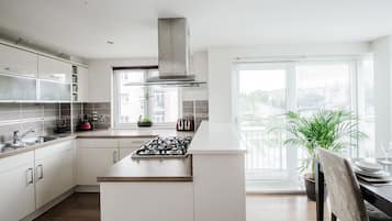 Apartment, 2 Bedrooms | Private kitchen | Fridge, microwave, stovetop, dishwasher