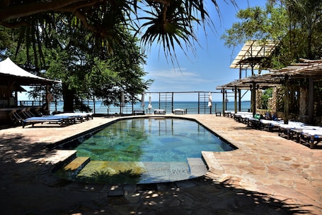 Outdoor pool, free cabanas, pool umbrellas