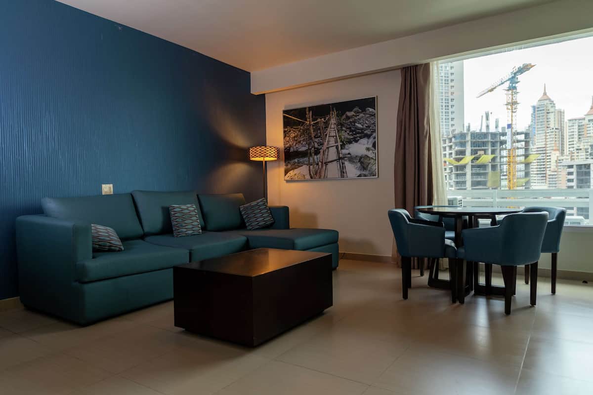 Suite, 1 King Bed, City View | Living area | 40-inch flat-screen TV with premium channels, TV, MP3 dock