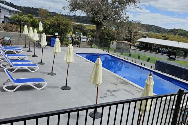 Outdoor pool, pool umbrellas, sun loungers