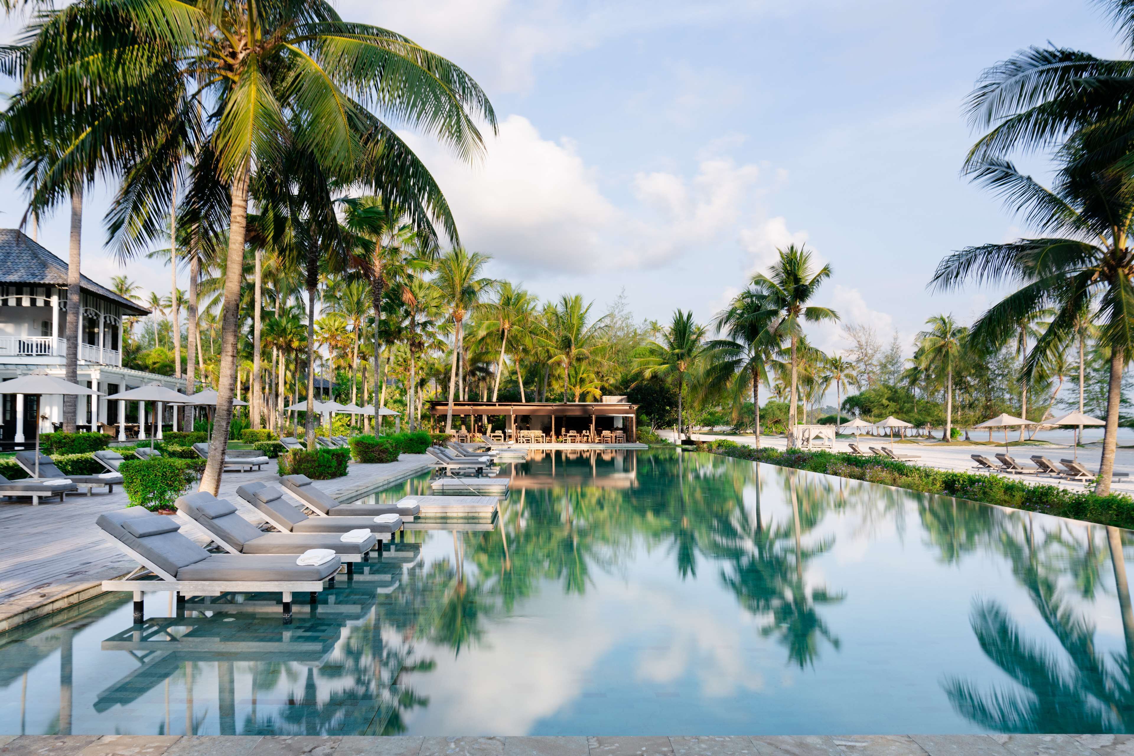 outdoor pool, open 8:00 am to 9:00 am, pool umbrellas, pool loungers