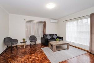 Two Bedroom Apartment with Garden | Living area | Flat-screen TV
