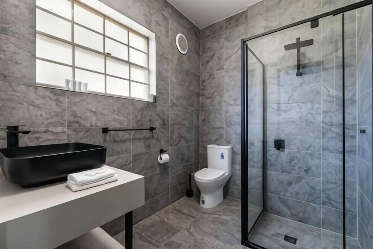 Bathroom | Shower, free toiletries, hair dryer, slippers