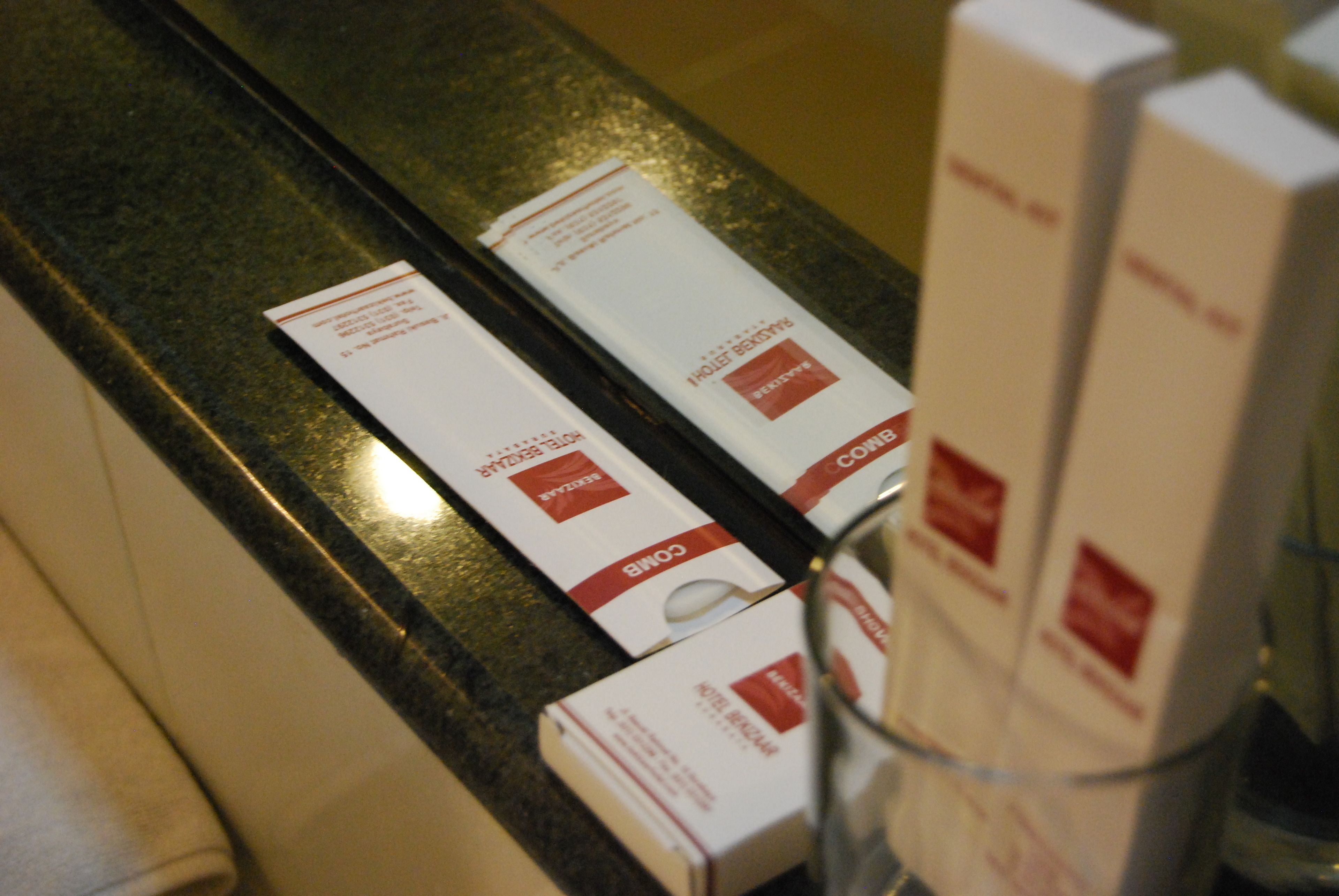 A countertop with several white boxes labeled "COLD" and a pair of glasses.