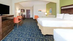 A hotel room with a large bed, a desk with a chair, a television, and a lamp. - Holiday Inn Express Hotel & Suites Monahans - I-20 by IHG (Monahans)