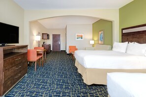 A hotel room with a large bed, a desk with a chair, a television, and a lamp. - Holiday Inn Express Hotel & Suites Monahans - I-20 by IHG (Monahans)