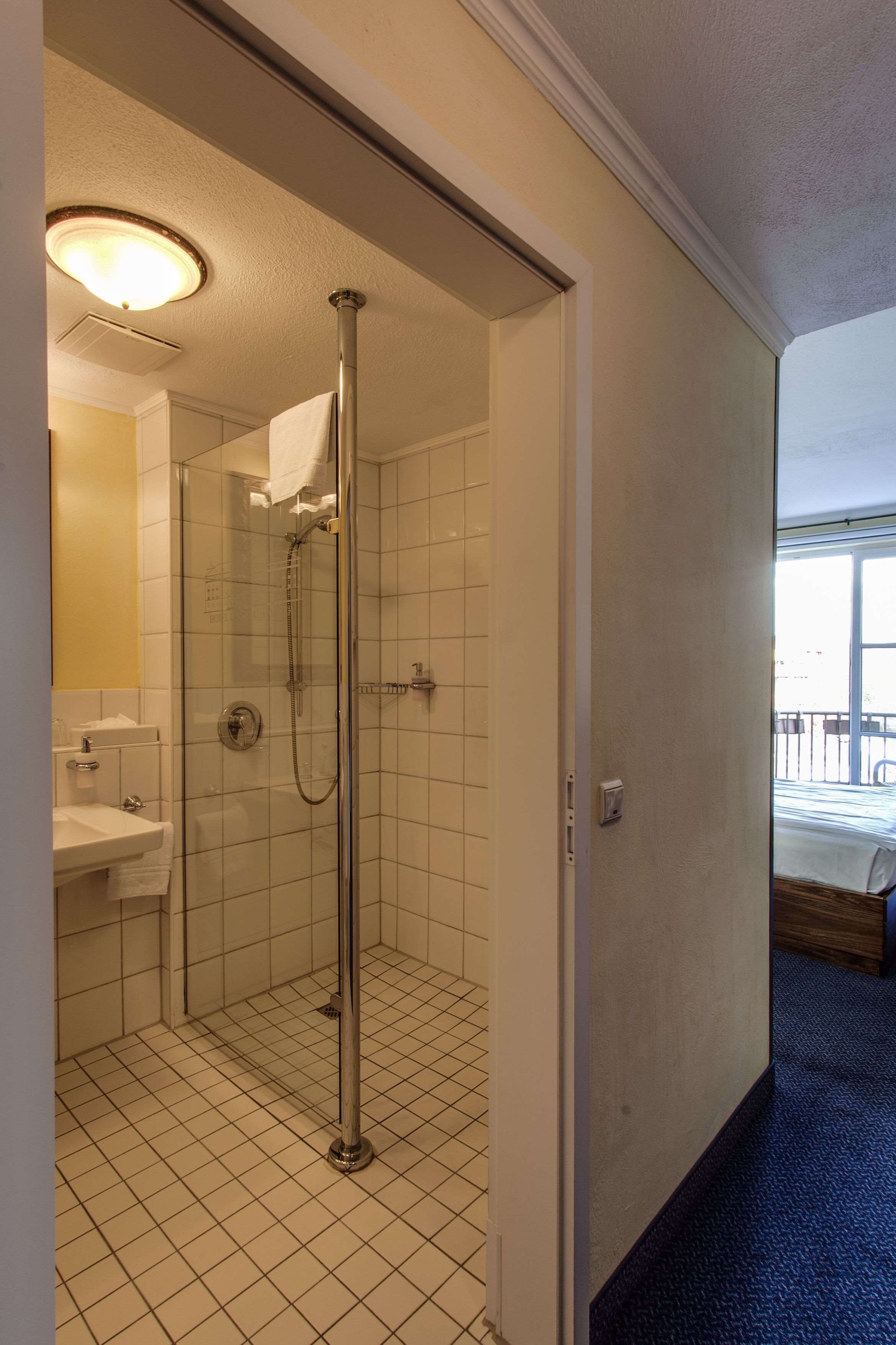 shower, free toiletries, hair dryer, towels