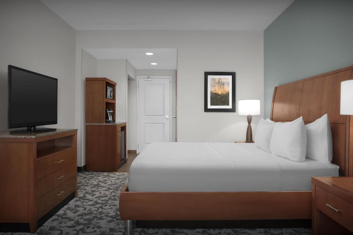 Egyptian cotton sheets, premium bedding, down duvets, laptop workspace