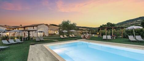 Seasonal outdoor pool, pool umbrellas, pool loungers