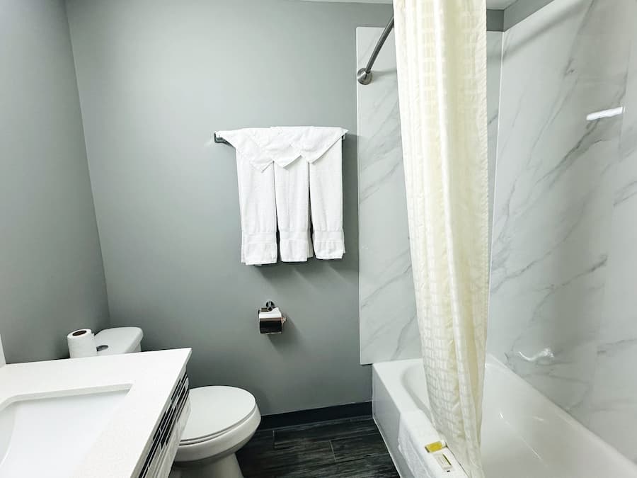 Room, 2 Double Beds | Bathroom | Towels, soap, shampoo, toilet paper