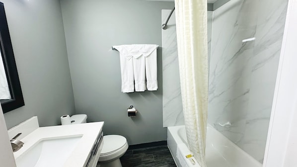 Room, 2 Double Beds | Bathroom | Towels, soap, shampoo, toilet paper