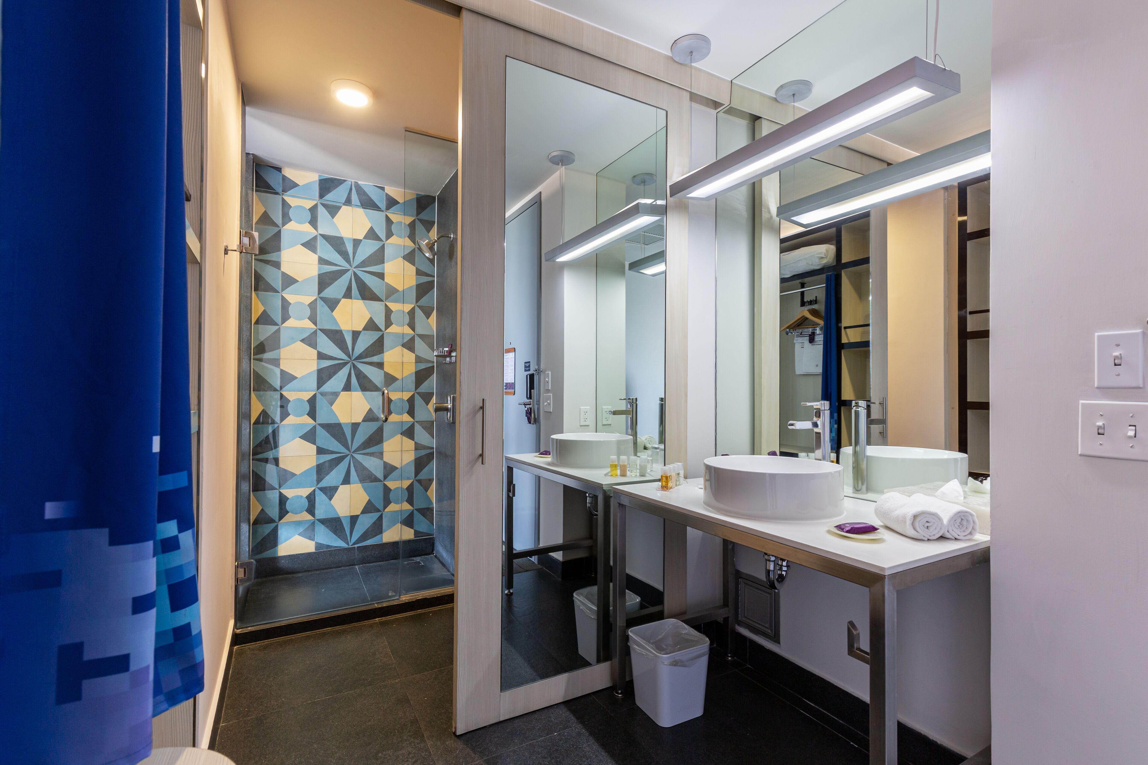 shower, rainfall showerhead, hair dryer, towels