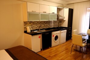 Fridge, stovetop, dishwasher, coffee/tea maker