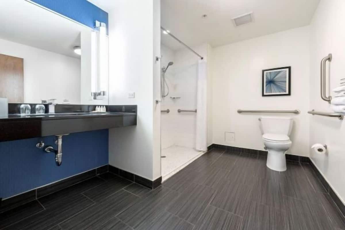 Shower, designer toiletries, hair dryer, bathrobes