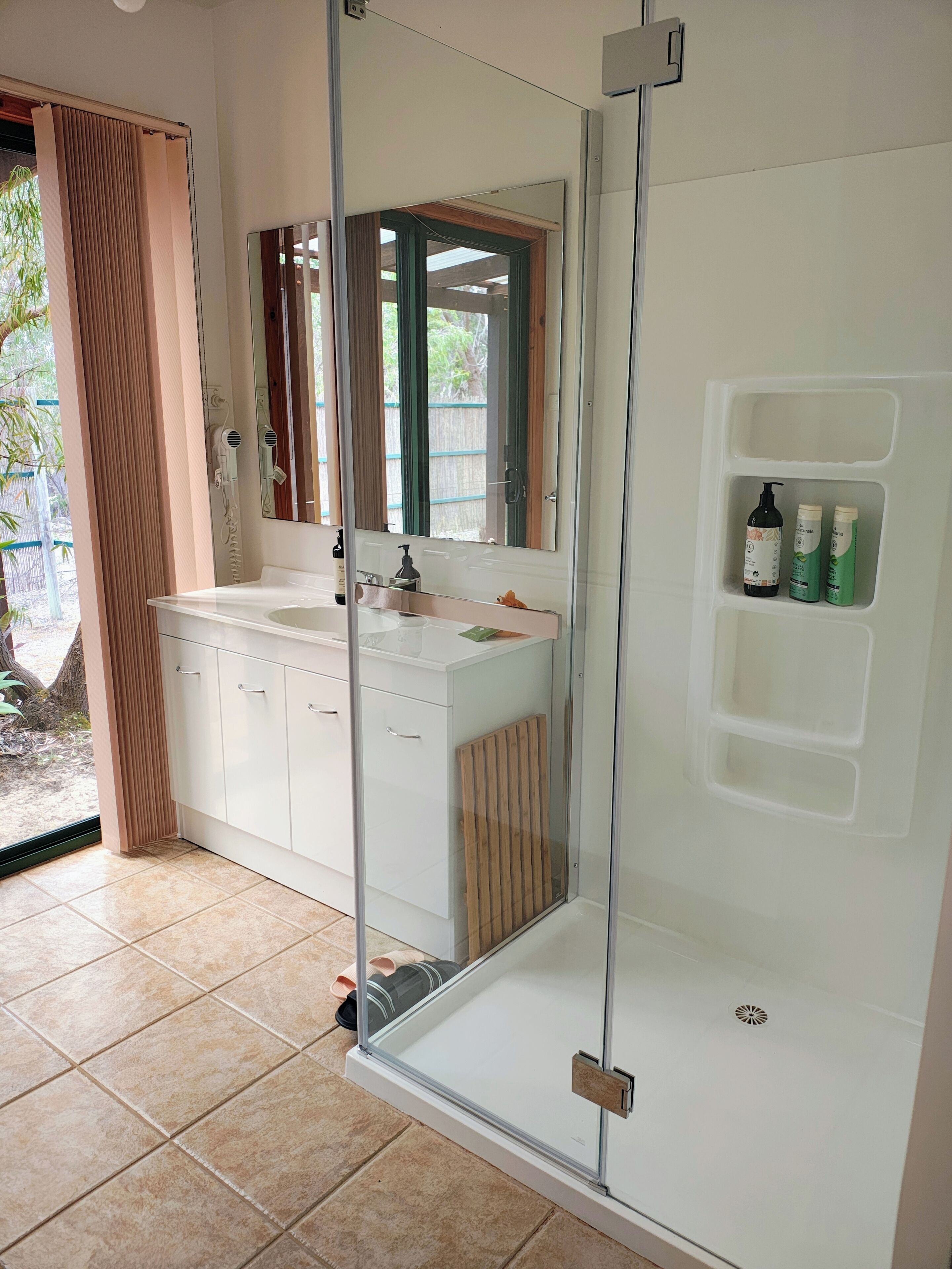 Spacious Studio | Bathroom | Hair dryer, towels, soap, shampoo