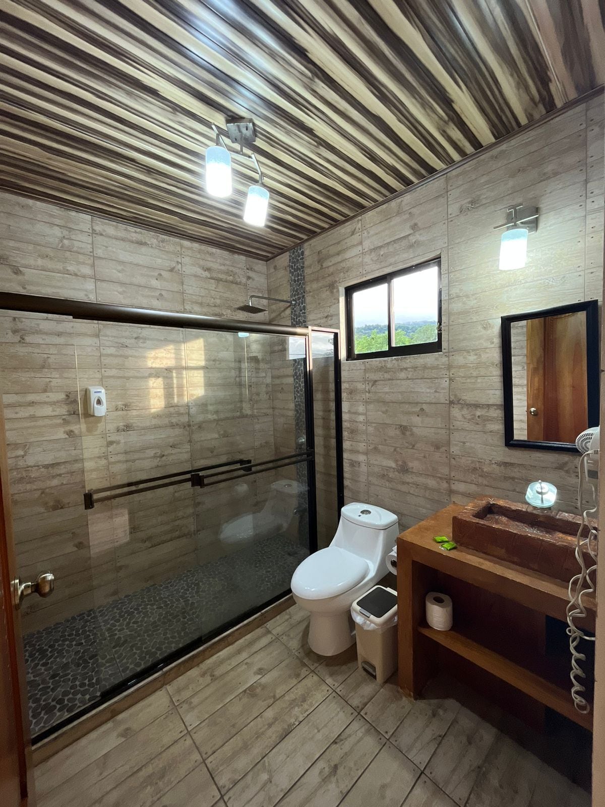 junior suite | bathroom | shower, rainfall showerhead, free toiletries, towels