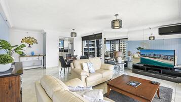 Deluxe Two Bedroom Ocean View Apartment | Living area | 55-inch flat-screen TV with cable channels, TV, DVD player