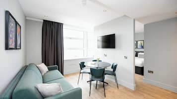 Apartment, 1 Bedroom | Living area | 32-inch flat-screen TV with digital channels, TV