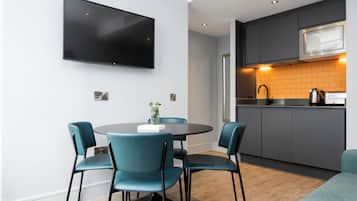 Apartment, 1 Bedroom | Living area | 32-inch flat-screen TV with digital channels, TV